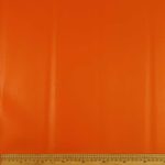 Metro Lifestyle’s Vinyl Plain 140cm Orange – Smooth, durable orange vinyl fabric, perfect for upholstery, car interiors, and DIY décor projects.