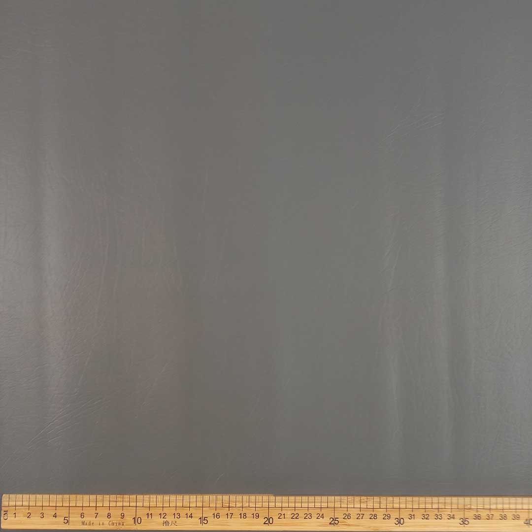 CU130121-7_1.jpg Metro Lifestyle’s Vinyl Plain 140cm Silver – Smooth, durable silver vinyl fabric, perfect for upholstery, car interiors, and DIY décor projects.