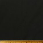 Plain Sheeting 240cm Black fabric featuring a smooth texture and deep, elegant black color for versatile use in various projects.