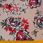 Scuba Crepe Peach Floral Printed – Elegant peach fabric with a delicate floral print, ideal for creating chic garments, home décor, and accessories, offering sophistication and lasting durability.