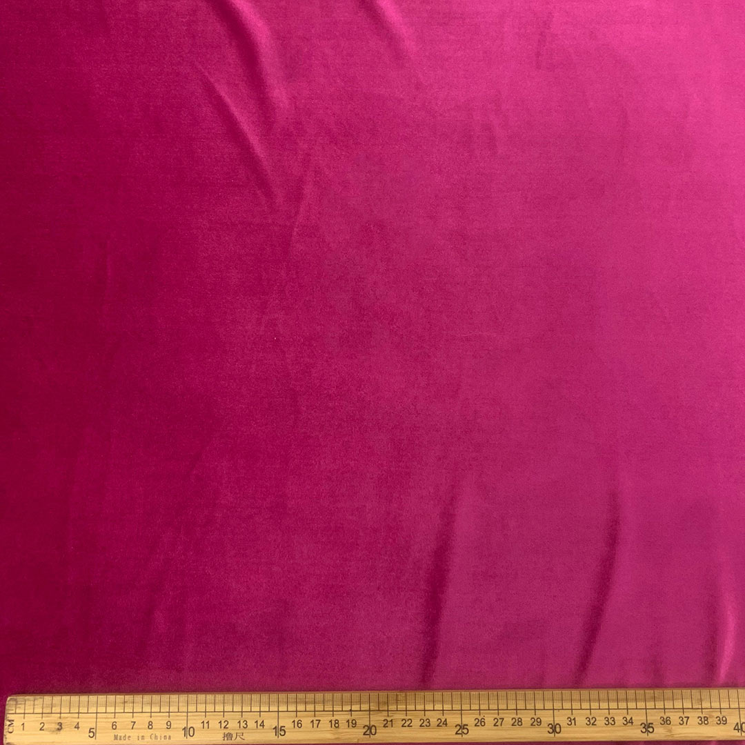 DR15043-007_1.jpg Stretch Velvet Plain Cerise Pink 150cm 7, luxurious fabric in vibrant cerise pink for stunning creations.