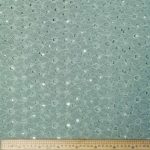 Lace Poly (D) fabric with an intricate lace design, made from durable polyester, ideal for creating stylish garments and home decor items.