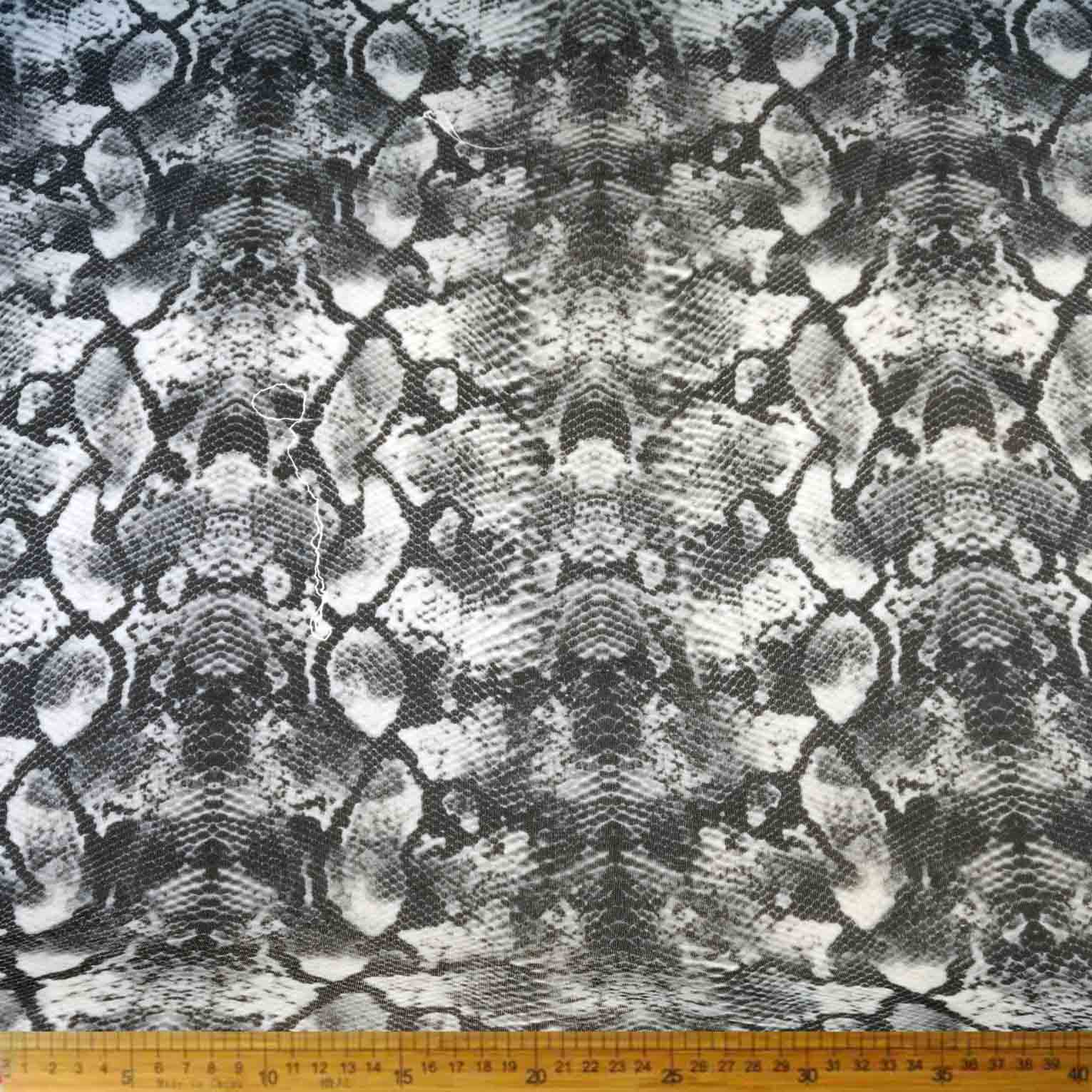 DR0910-10_1.jpg Scuba Printed 150cm -10 fabric with a bold print, ideal for versatile projects like fashion and home decor. Durable and stretchy for a comfortable fit.