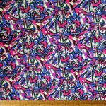 Scuba Printed 150cm -10 fabric with a vibrant design, perfect for making dresses, skirts, cushions, and other home decor items.