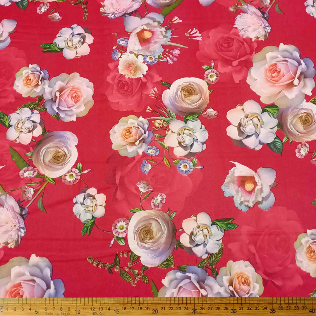 DR10996-03_1.jpg Scuba Digital Print Red Floral fabric, available at Metro Lifestyle, featuring a vibrant floral design and a smooth texture for stylish, comfortable garments.