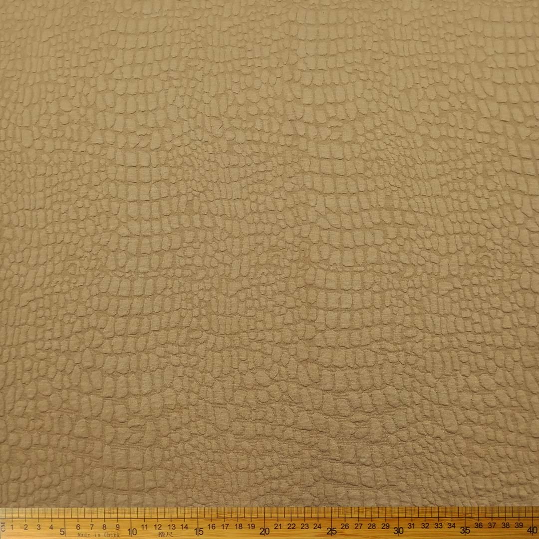 DR15306-052_1.jpg Knitted Jacquard Bubble Sand 15306/052 fabric with bubble texture and warm sand color, perfect for home décor, fashion, and upholstery projects.
