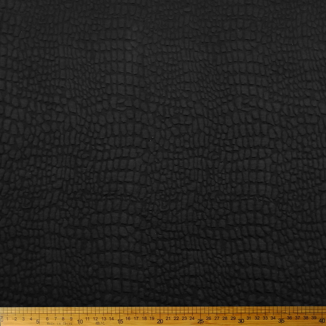 DR15306-069_1.jpg Knitted Jacquard Bubble Black 15306/069 fabric with a bubble pattern, perfect for fashion and home décor projects.